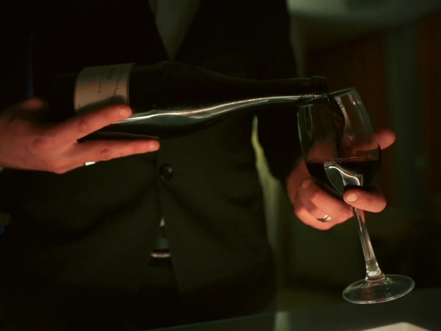 Red wine poured at a table